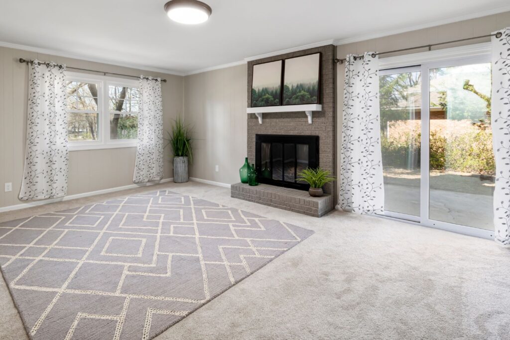 Bright living room with clean carpet and windows after expert move in cleaning services in New Jersey